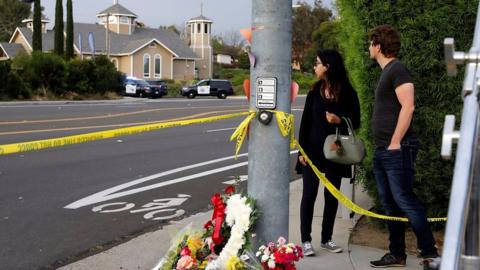 Flowers near the scene of the shooting.