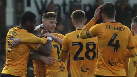 Newport County players celebrate Shane McLoughlin's goal against Barnet