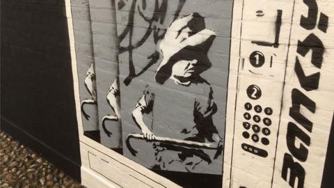 Joe Thompson's version of the Banksy mural