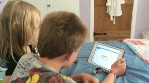 Children looking at a tablet