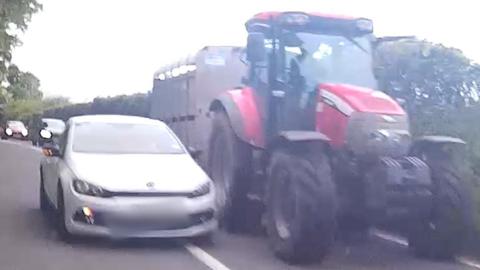 Car overtakes tractor