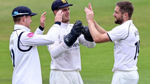 Warwickshire's Chris Woakes celebrated taking the wicket of England team-mate Dawid Malan at Headingley