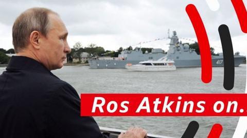 Putin looking at military ship