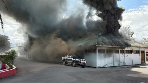 A building burns as fresh protests break out in Wamena on September 23, 2019