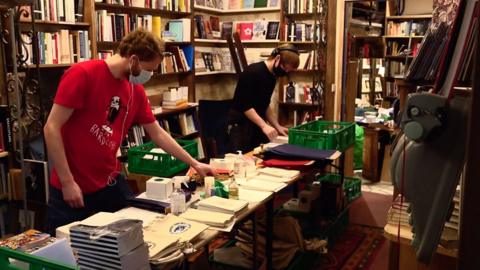 Workers in a bookshop