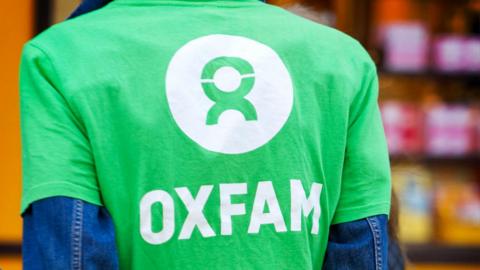Man wearing Oxfam T-shirt