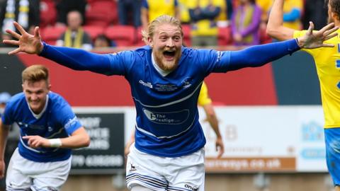 Luke Armstrong celebrates