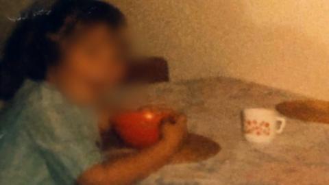 Picture of a young girl with an orange cup