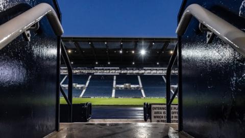 Hawthorns Stadium, home of West Brom, with a view from the concourse steps out onto the stand and pitch