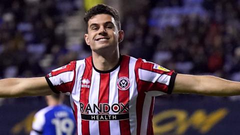 John Egan celebrates after scoring for Sheffield United