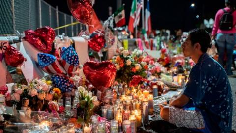 Man sits by vigil