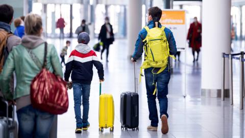 Passengers arrive at Terminal 2 of the Airport in Munich, Germany, 26 March 2021.