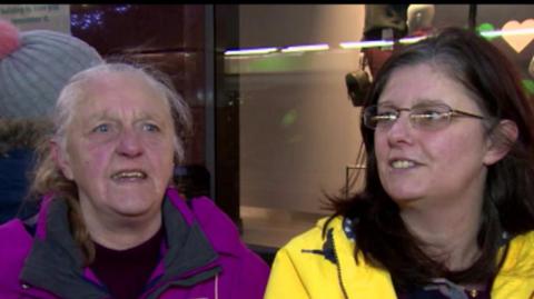 Two ladies queue up outside the new Primark store in Belfast on Saturday 8 December