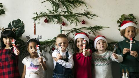 Children with Christmas designs