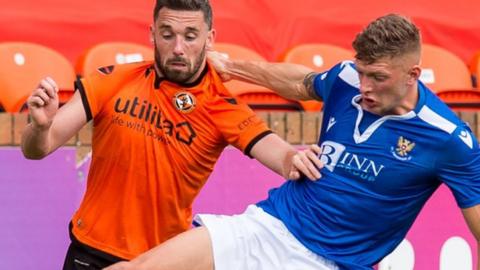 Dundee United's Nicky Clark and St Johnstone's Liam Gordon