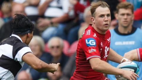 Ioan Lloyd makes a break for Scarlets