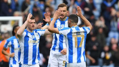 Huddersfield Town players celebrate Rhys Healey's second-half equaliser