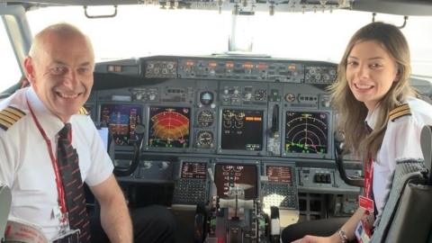 Brian Morgan and his daughter Becky in the cockpit of a plane together