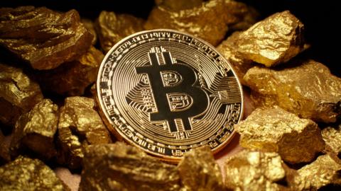 Bitcoin and a pile of gold