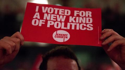 Jeremy Corbyn supporter holds up a sign