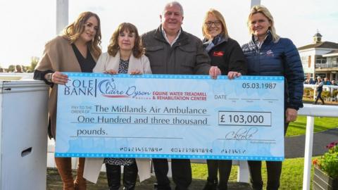 L-R: Stephanie, Diane and Roger Cole (Charlotte’s sister and parents), Emma Wood, head of fundraising and marketing for Midlands Air Ambulance Charity, and Claire Dyson of Claire Dyson Racing