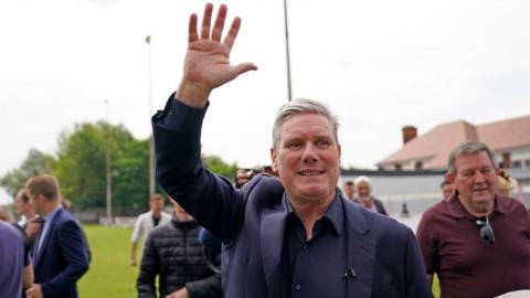 Sir Keir Starmer waves on the day of the July by-election results