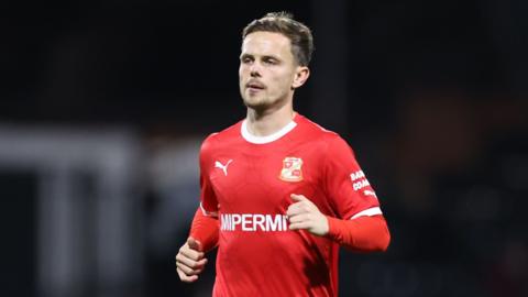 Liam Kinsella on the pitch for Swindon