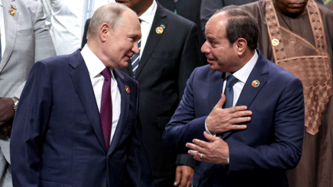 Russian President Vladimir Putin and Egyptian President Abdel Fattah al-Sisi talking as they pose for a photo at the Russia-Africa summit in St Petersburg