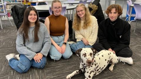 Students and a dog