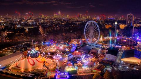 Aerial view of Winter Wonderland which features an ice rink, market and fairground rides