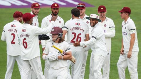 Northants celebrate the wicket of Rory Burns