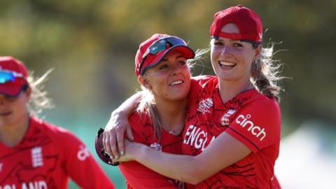 England's Lauren Bell celebrates with Sarah Glenn after they beat South Africa in a warm-up game before the ICC Women's T20 World Cup