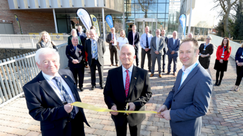 Glen Sanderson cuts the ribbon for Morpeth's new leisure centre