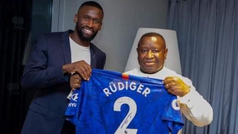 Chelsea's Antonio Rudiger (left) hands over a signed shirt to Sierra Leone President Julius Maada Bio