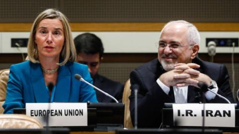 Federica Mogherini (L), European Union's High Representative for Foreign Affairs and Security Policy, and Iran's Foreign Minister Mohammad Javad Zarif attend a ministerial meeting of the P5+1 countries on 25 September 2018