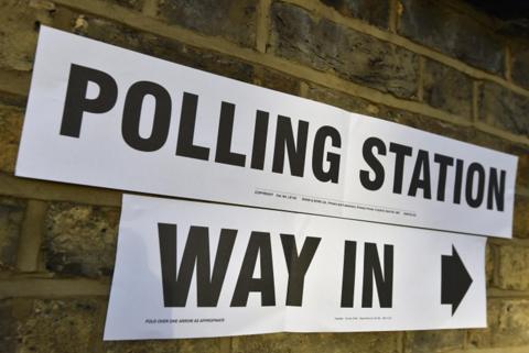Sign showing way into polling station