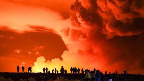 smoke billows from volcano eruption