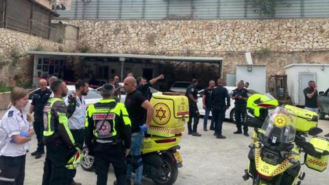 Israeli police and first responders at the scene of a suspected criminal attack in which five people were killed in Yafa an-Naseriyye, a south-western suburb of Nazareth, Israel (8 June 2023)