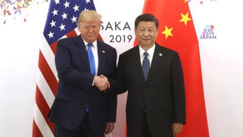 Chinese President Xi Jinping (R) shakes hands with US President Donald Trump before a bilateral meeting during the G20 Summit on 29 June, 2019 in Osaka, Japan