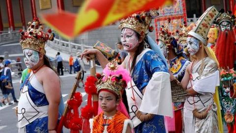 worshippers in costume, part of the protest