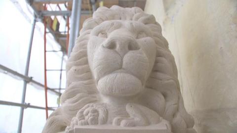 Stone carving of a lion's head