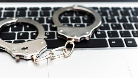 Handcuffs on keyboard