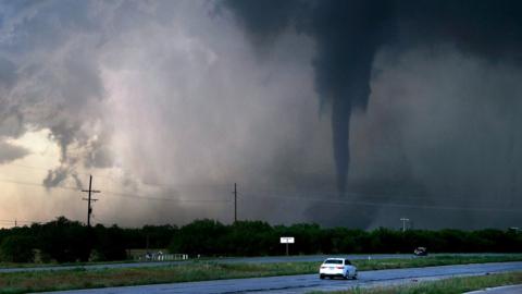 A tornado spins as cars pass on U.S. 277 west of Hawley, Texas, U.S. May 2, 2024.