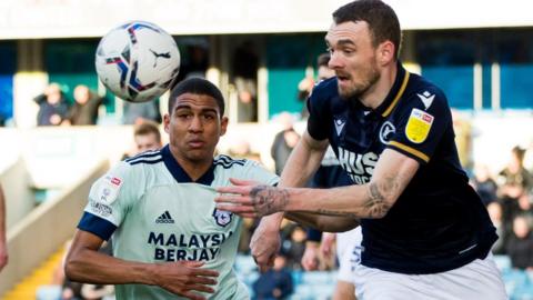 Scott Malone of Millwall and Cody Drameh of Cardiff City battle for the ball