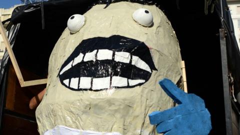 A giant gnocchi dummy during a demo against the massive firing of civil servants in downtown Buenos Aires, on 29 January 2016