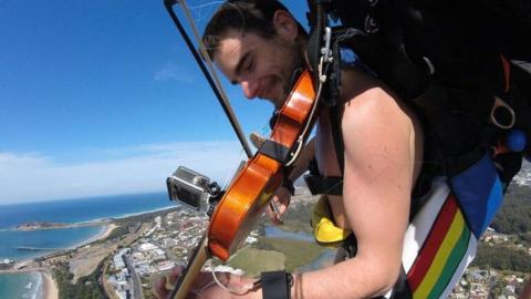 Violinist skydives over Coffs Harbour in the nude