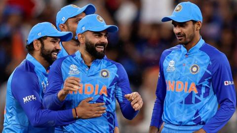 Virat Kohli and India celebrate a wicket against Zimbabwe at the Men's T20 World Cup
