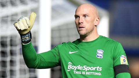 Birmingham City goalkeeper John Ruddy gives the thumbs up to the fans