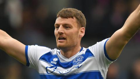 Chris Martin holds his hands in the area after scoring a goal for QPR last season