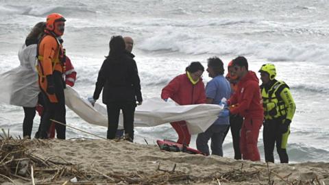 Rescuers on a beach